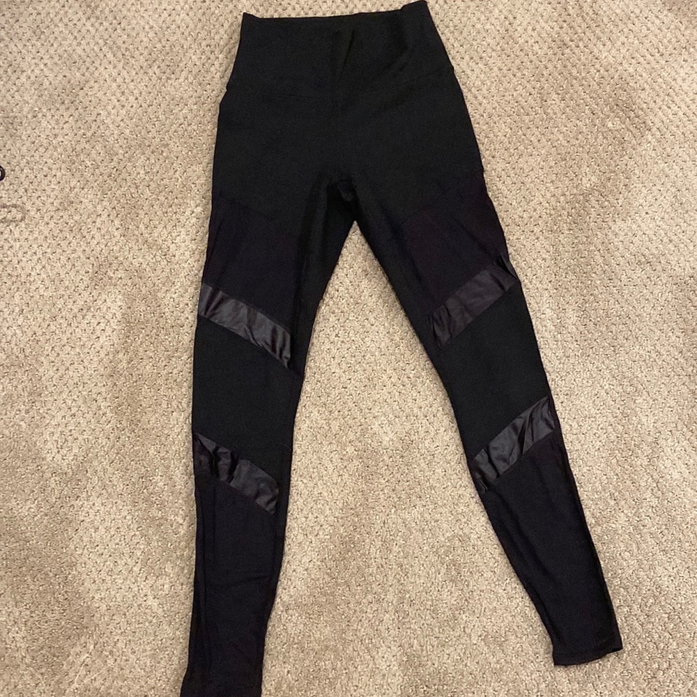 Black Fabletics leggings with leather mesh side detail